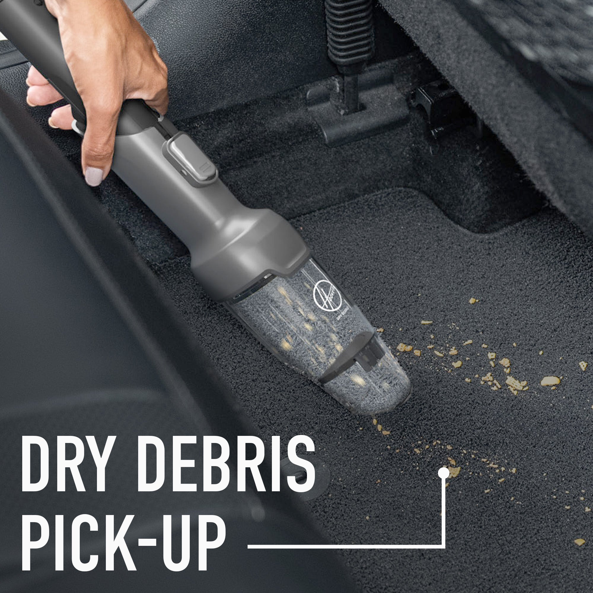 Close-up of the Hoover dry debris tool cleaning crumbs out of car interior.