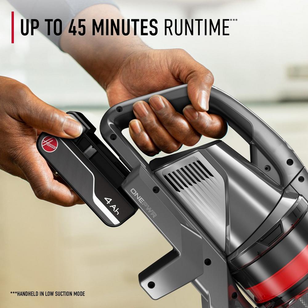 Close up of a hand inserting its 4 Ah battery into a hoover onepwr cordless vacuum cleaner which offers up to 45 minutes runtime in low suction mode.