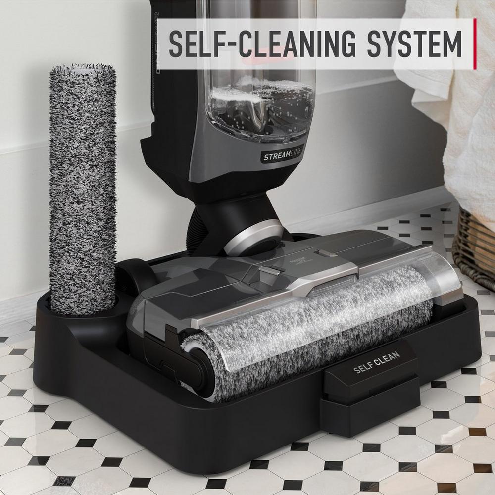 Streamline floor cleaner sitting in its automated self cleaning dock showcasing its easy maintenance.