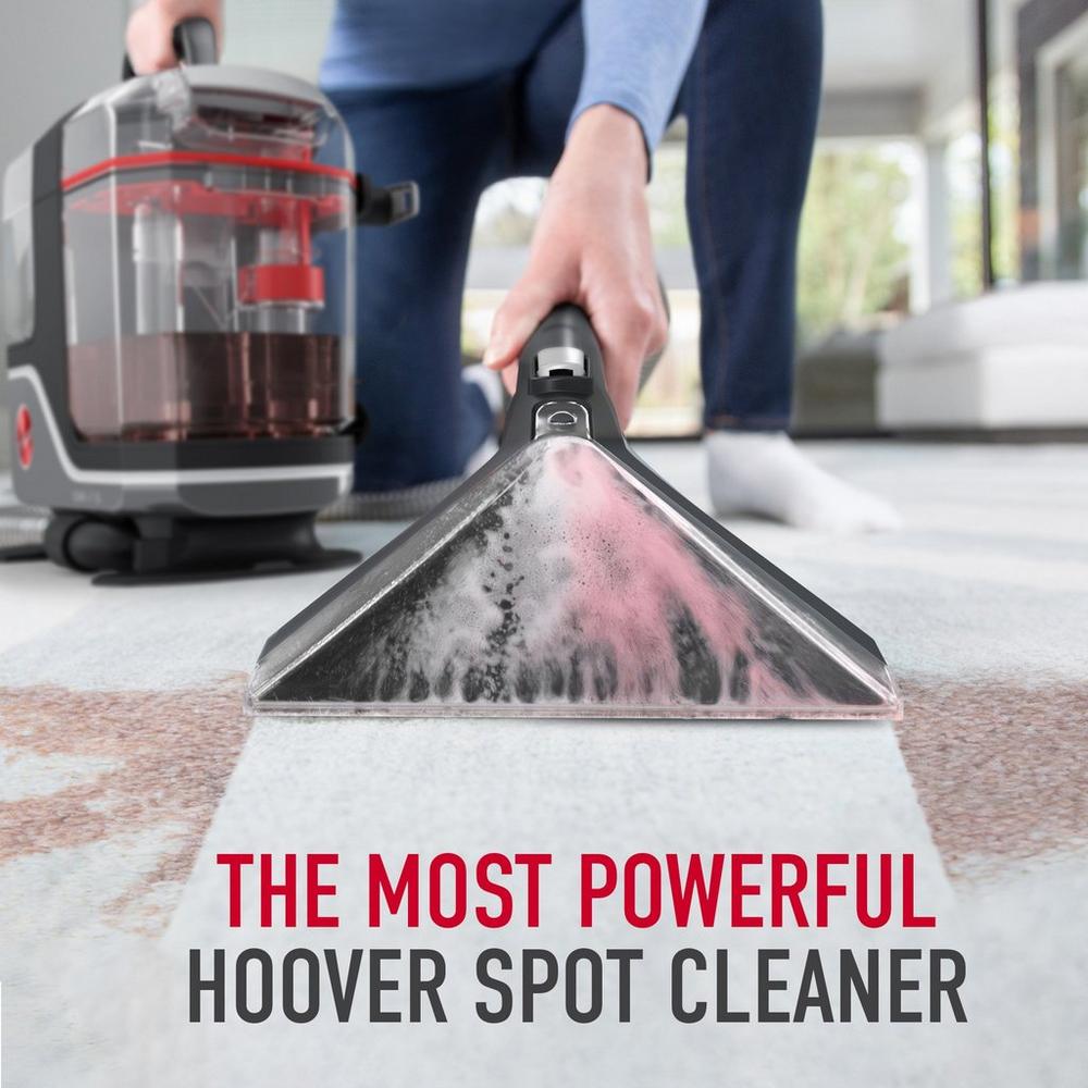 Close up of the most powerful Hoover spot cleaner in action, deep cleaning a tough stain on a white carpet
