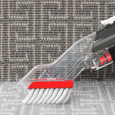 Hoover tight spot tool is shown in the crevices of stairs, displaying its ability to reach tight spots