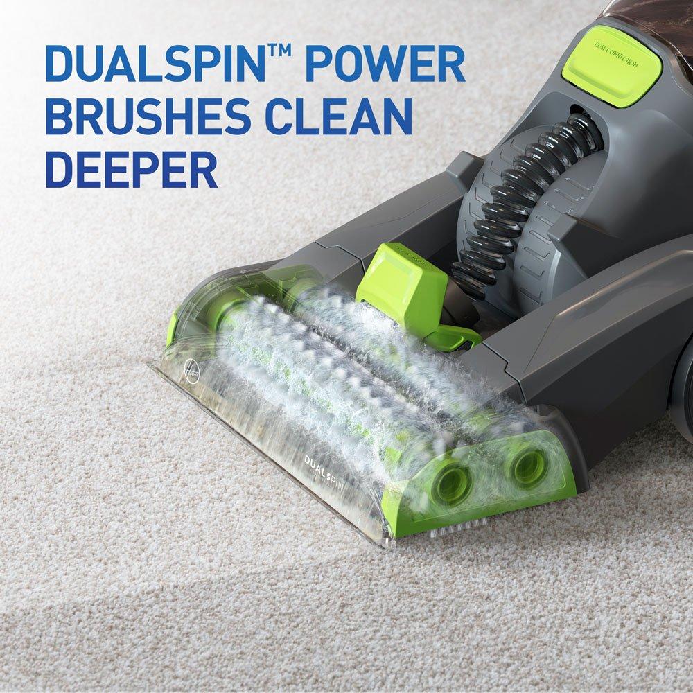 Close-up of a carpet cleaner's DualSpin™ power brushes designed for deeper cleaning, showcasing their advanced cleaning mechanism on a plush carpet.