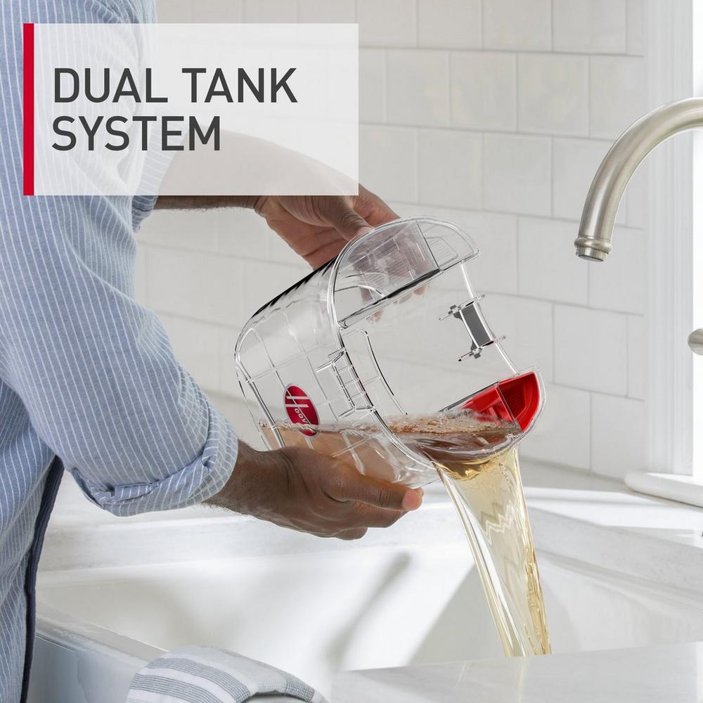 Person pouring dirty water from the dual tank system of a carpet cleaner into a sink, demonstrating the effective separation of clean and dirty water for enhanced cleaning efficiency.