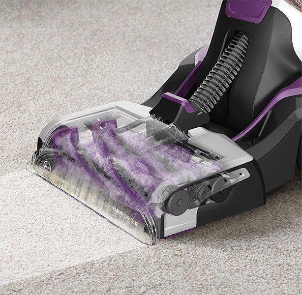 Close up of Hoover smartwash pet carpet cleaner's dual antimicrobial brush rolls in action, highlighting its deep carpet cleaning capabilities