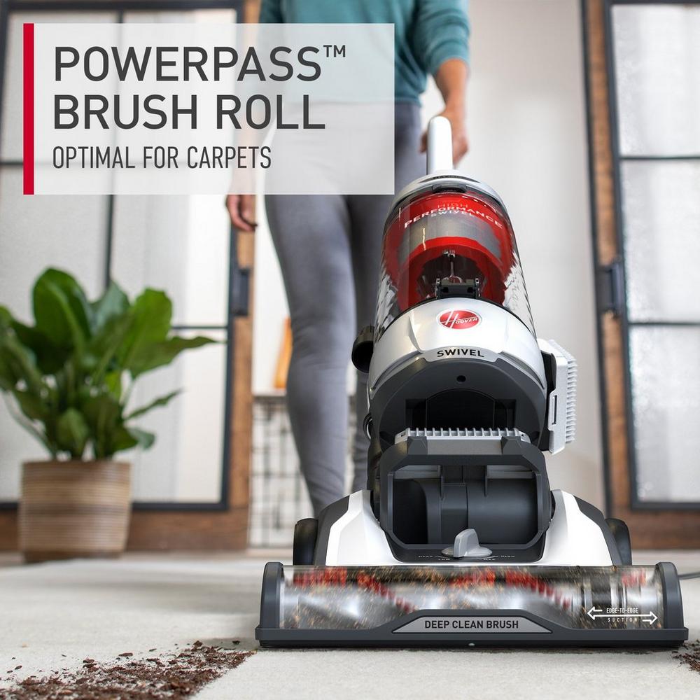 Hoover vacuum cleaner in action featuring the powerpass brush roll, optimal for cleaning carpets.