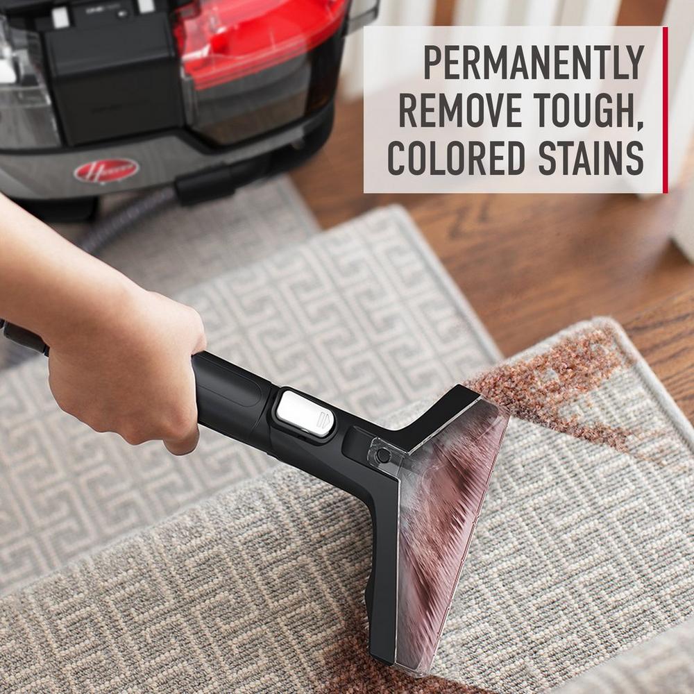 Hoover Cleanslate portable carpet cleaner removing tough, colored stains from stairs, showcasing its powerful stain removal capabilities