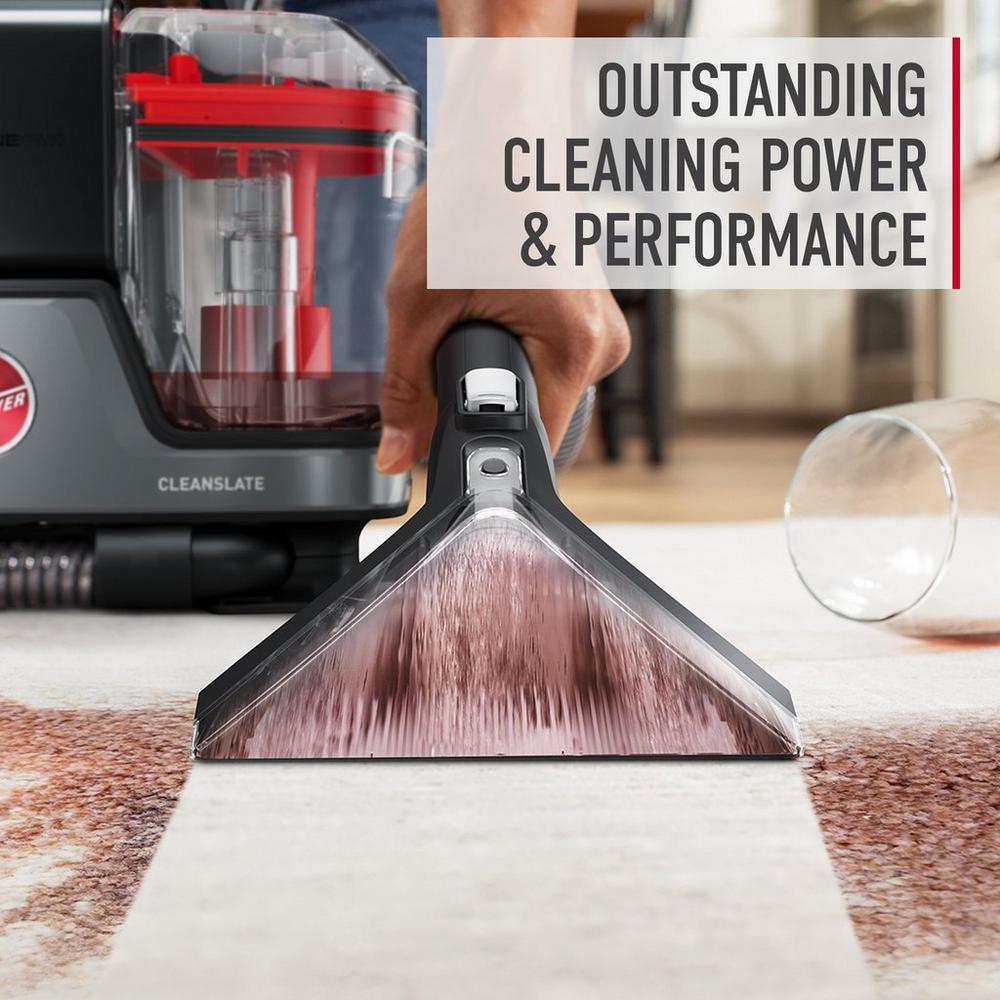 Close up of cleanslate cordless spot cleaner in action efficiently removing a dark colored stain from a white carpet, showcasing its outstanding cleaning power and performance