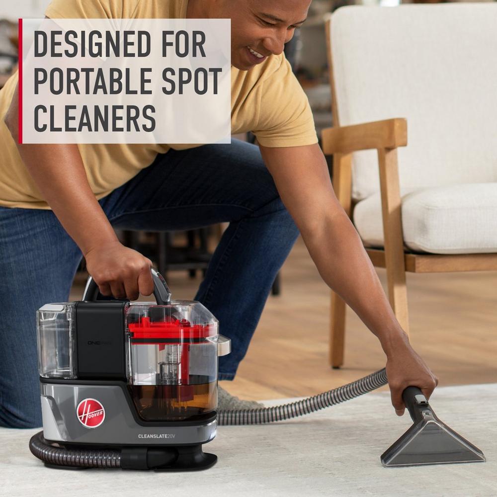 Cleanslate cordless spot cleaner highlighting its portability by easily cleaning the middle of an area rug