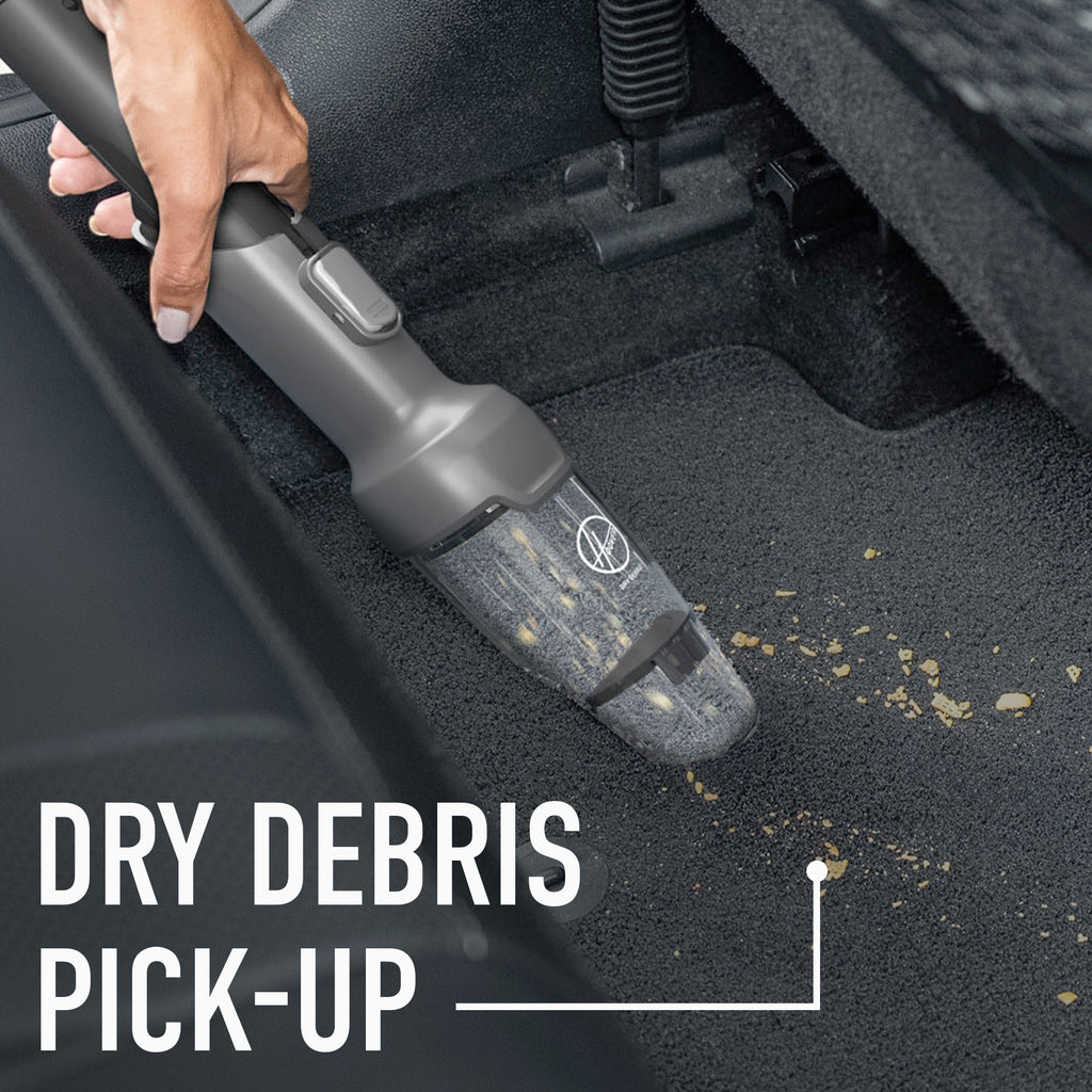 Close-up of the Hoover dry debris tool cleaning crumbs out of car interior.  