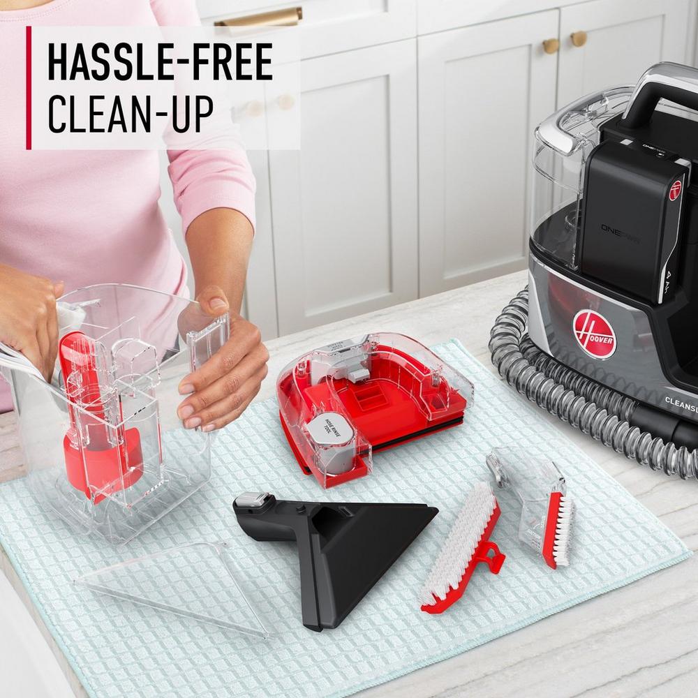 Hassle free clean up with Hoover cleanslate portable carpet and upholstery cleaner, featuring easy to dissemble parts for thorough cleaning and maintenance.  Cleanslate is sitting on the table next to the widepath tool, tight spot tool, and hose rinse tool 