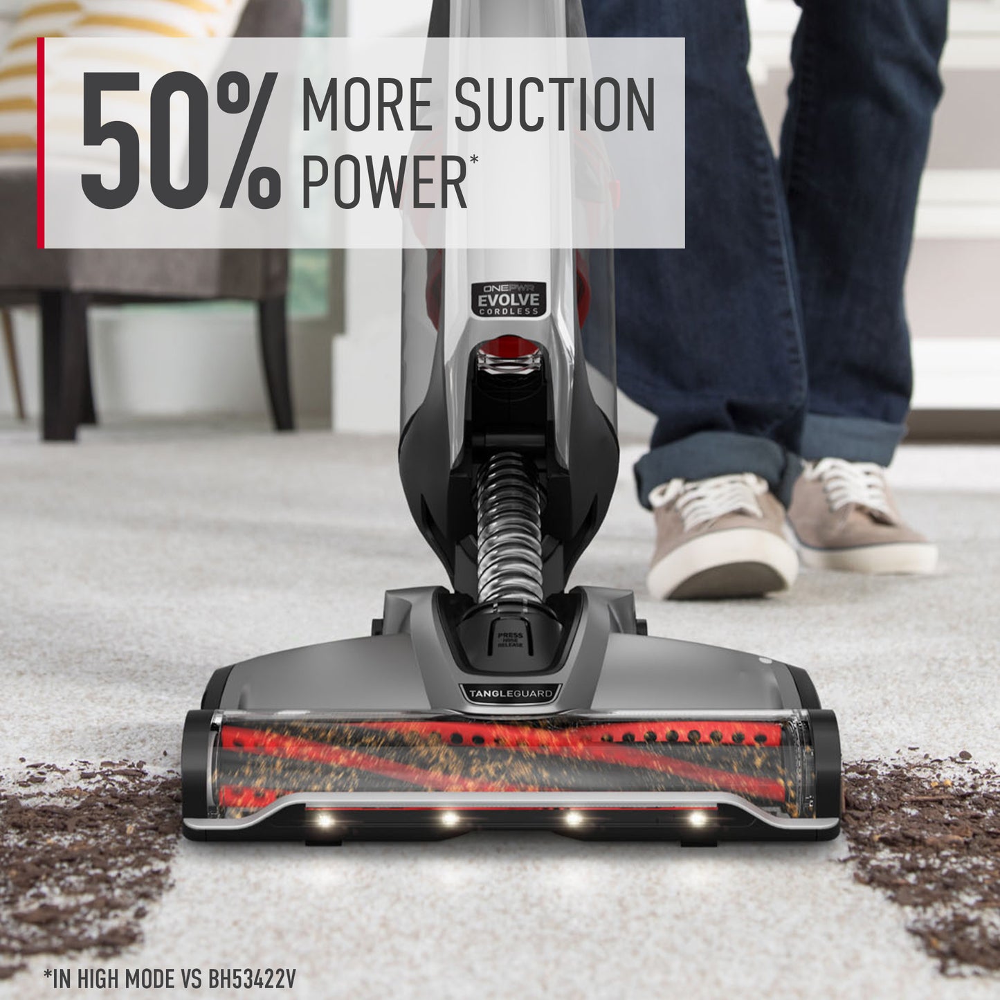 Close up of ONEPWR evolve pet elite cordless upright vacuum thoroughly cleaning dirt and debris out of white carpet displaying 50% more suction power