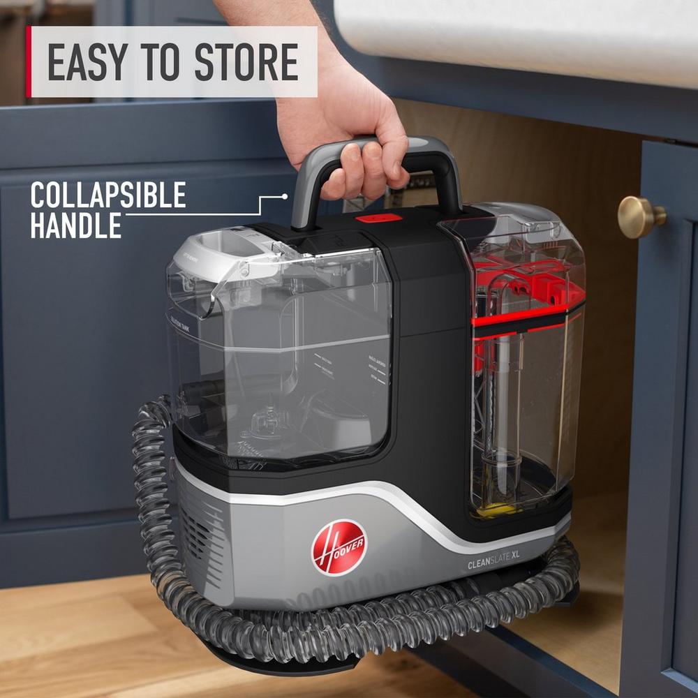 Hoover cleanslate xl being placed in a kitchen cabinet showcasing its collapsible handle and compact design for easy storage