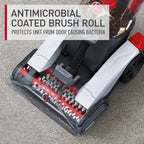 Close-up of the antimicrobial coated brush roll in a carpet cleaner, designed to protect the unit from odor-causing bacteria for enhanced cleanliness.