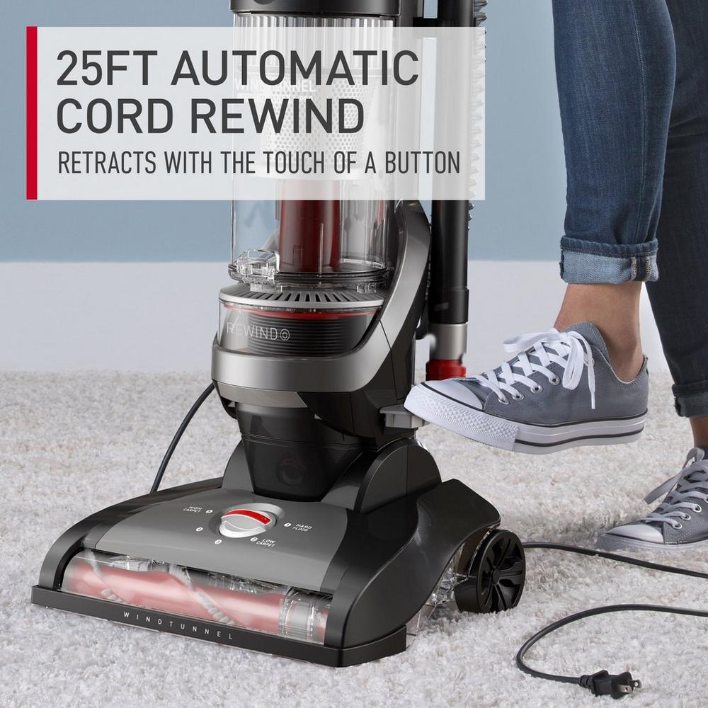 Close up of a Hoover windtunnel cord rewind pro featuring a 25ft automatic cord rewind function, which retracts the cord effortlessly with the touch of a button, ideal for quick and easy storage 