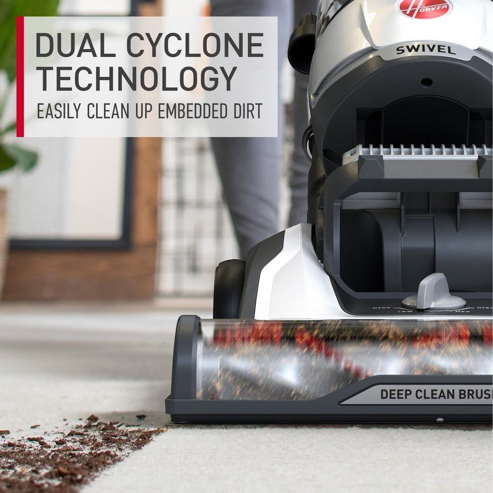 Close up of Hoover vacuum cleaner with dual cyclone technology easily cleaning up embedded dirt.