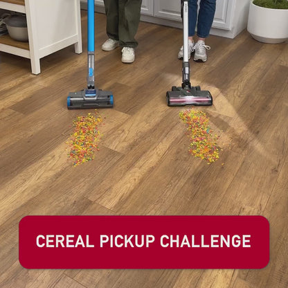 Video of The Hoover ONEPWR Emerge Cordless Stick Vacuum cleaning cereal off the floor against a Shark Stick Vacuum. Hoover cleans up all the cereal while Shark pushes it around and leaves behind a mess.