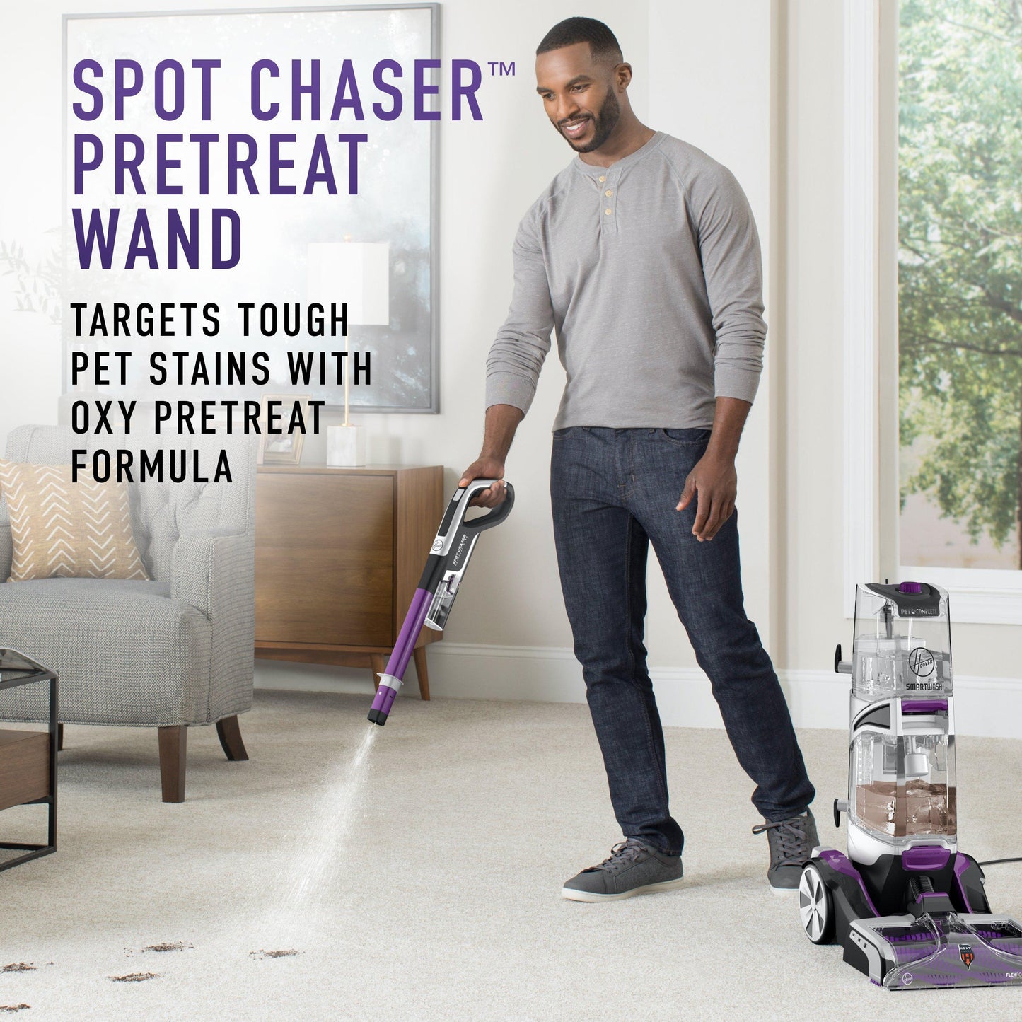 Man using carpet cleaner shows how the pretreat wand helps clean muddy paw prints on white carpet